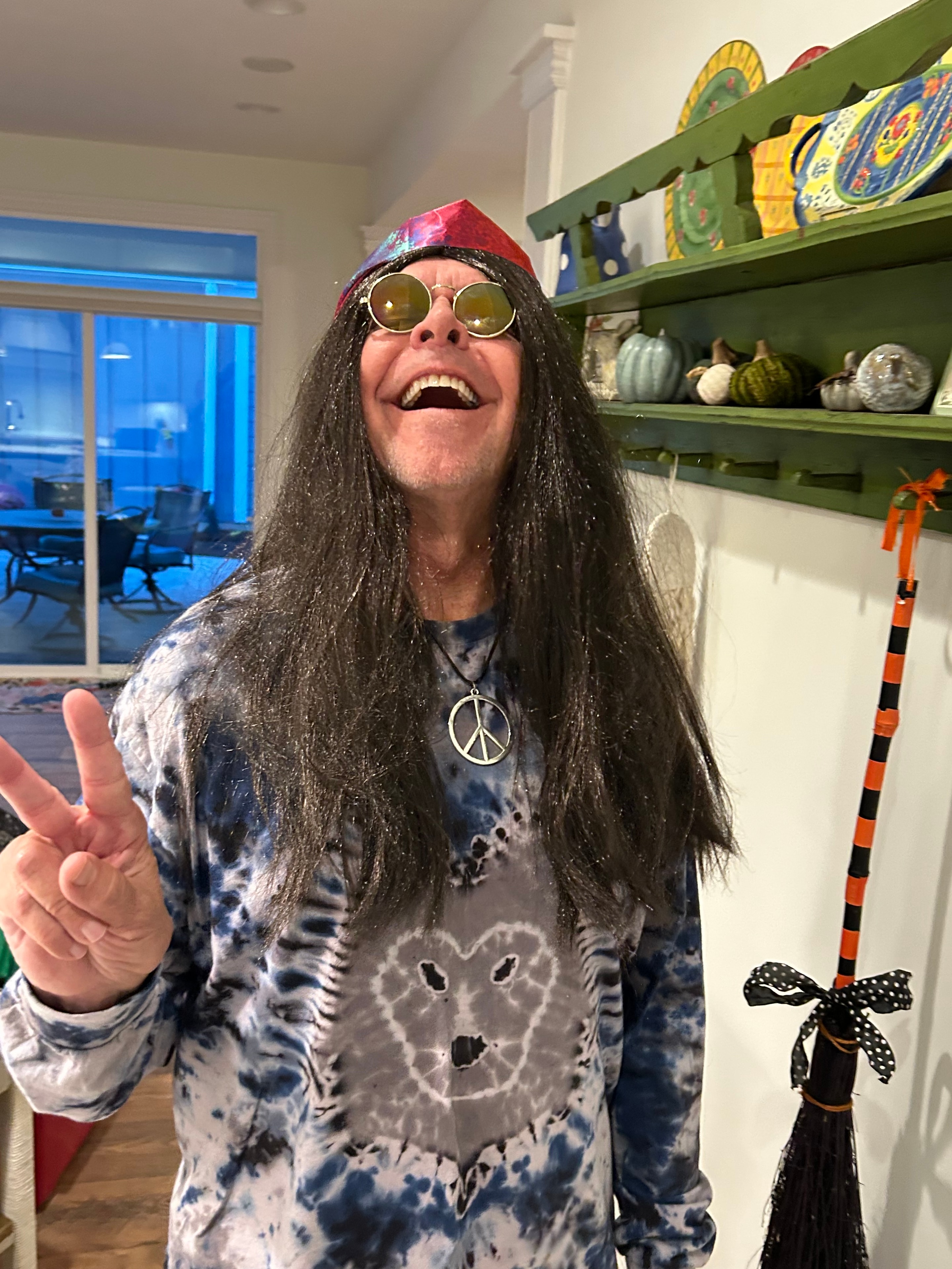 Dave Dugan in hippie Halloween costume with long hair and tie-dye